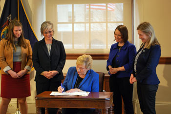 Photo of Governor Mills signing LD278