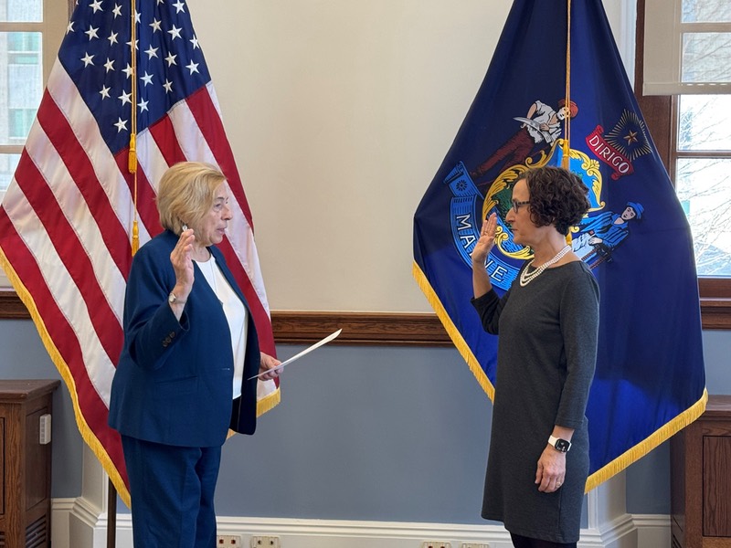 Joan Cohen being sworn in by Governor Mills