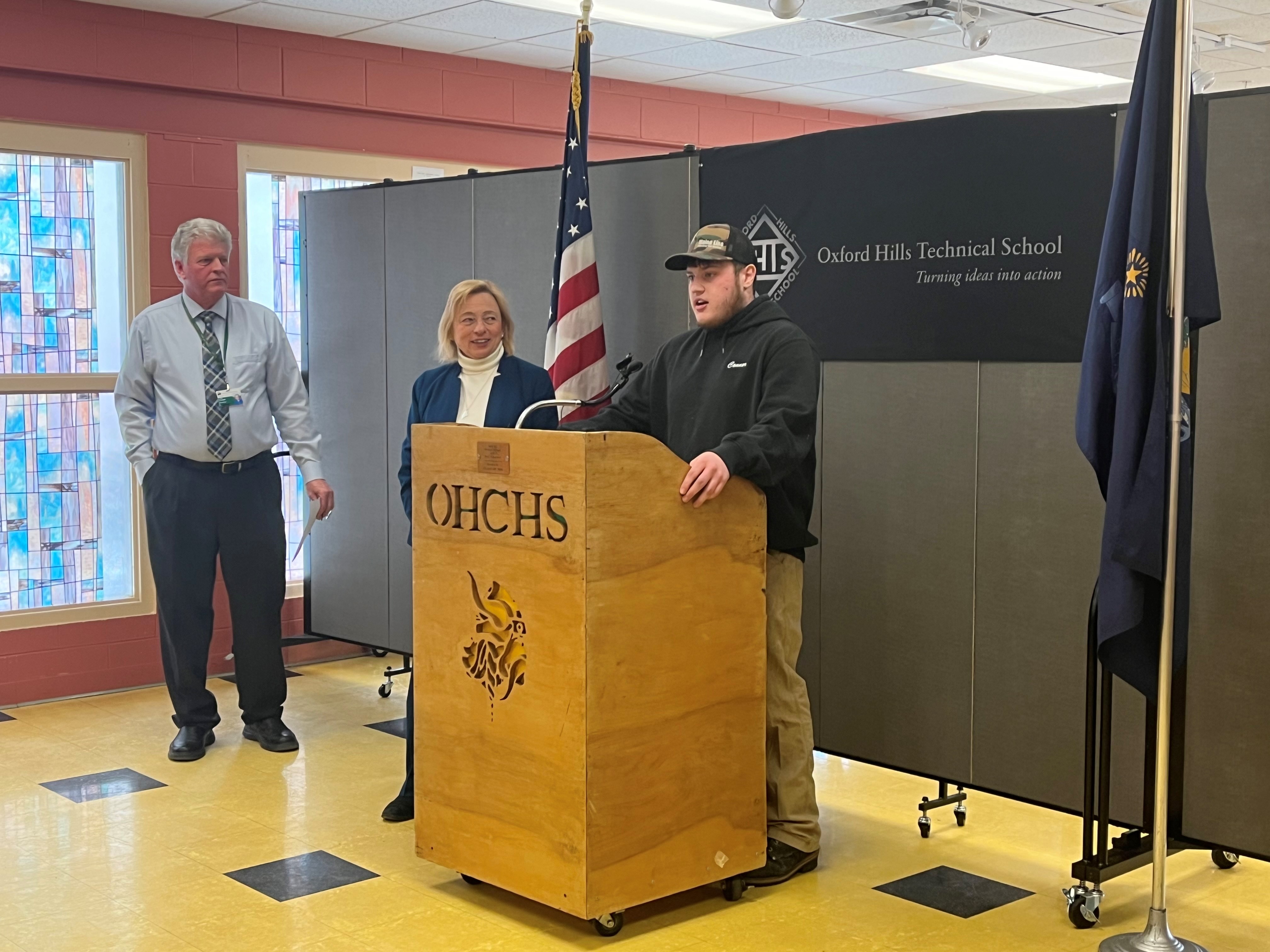 Oxford Hills Technical School Director Randy Crockett, Governor Janet Mills, and plumbing student Conner Cram