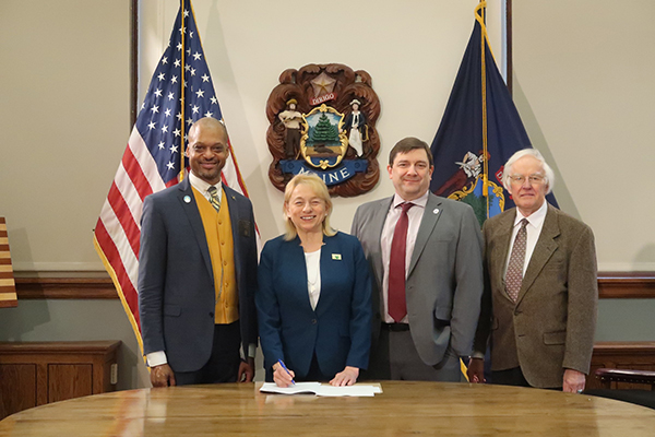 Senate President Jackson, Governor Mills, Senator Hickman, and Representative John Martin