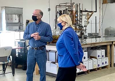 Ron Howard of Brodis Blueberries leads Governor Mills on a tour.