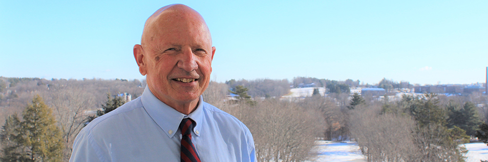 Rep. Brennan standing on the veranda at the state House.
