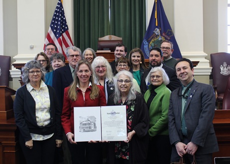 : Reps. Poppy Arford and Dan Ankeles, D-Brunswick, Rep. Kilton Webb, D-Durham, Rep. Rafael Macias, D-Topsham, Rep. Sally Cluchey, D-Bowdoinham, and Rep. Allison Hepler, D-Woolwich, presented longtime Executive Director Stacy Frizzle-Edgerton with a sentiment recognizing People Plus’s 50th anniversary. They were joined by members and directors of People Plus. 