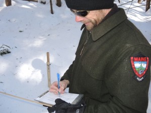 IFW Wildlife Biologist John Pratte records snow depth at a winter weather station in the Jamies Pond Wildlife Managment Area