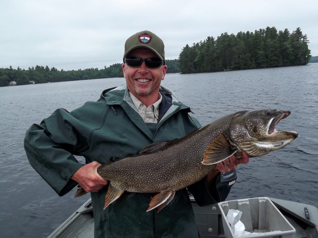 IFW's Tom Barrows holds a hefty 35-inch togue from Echo Lake
