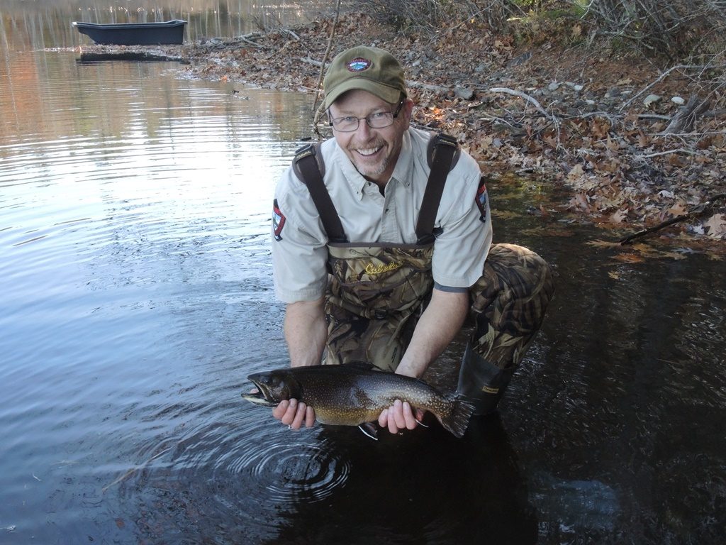 IFW fisheries assistant Tom Barrows prepares to release a nice brook trout.