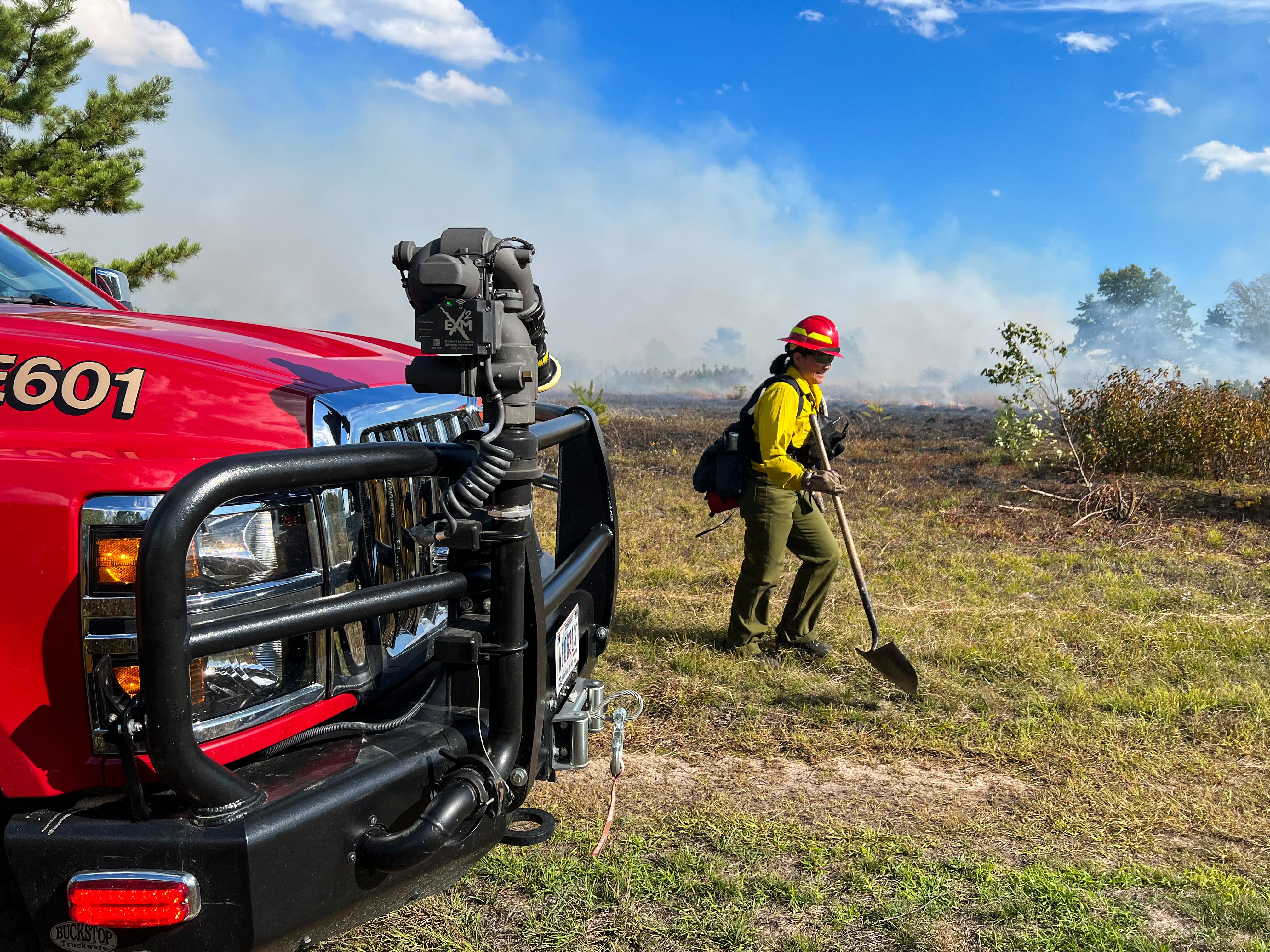 fire crew member and a fire engine