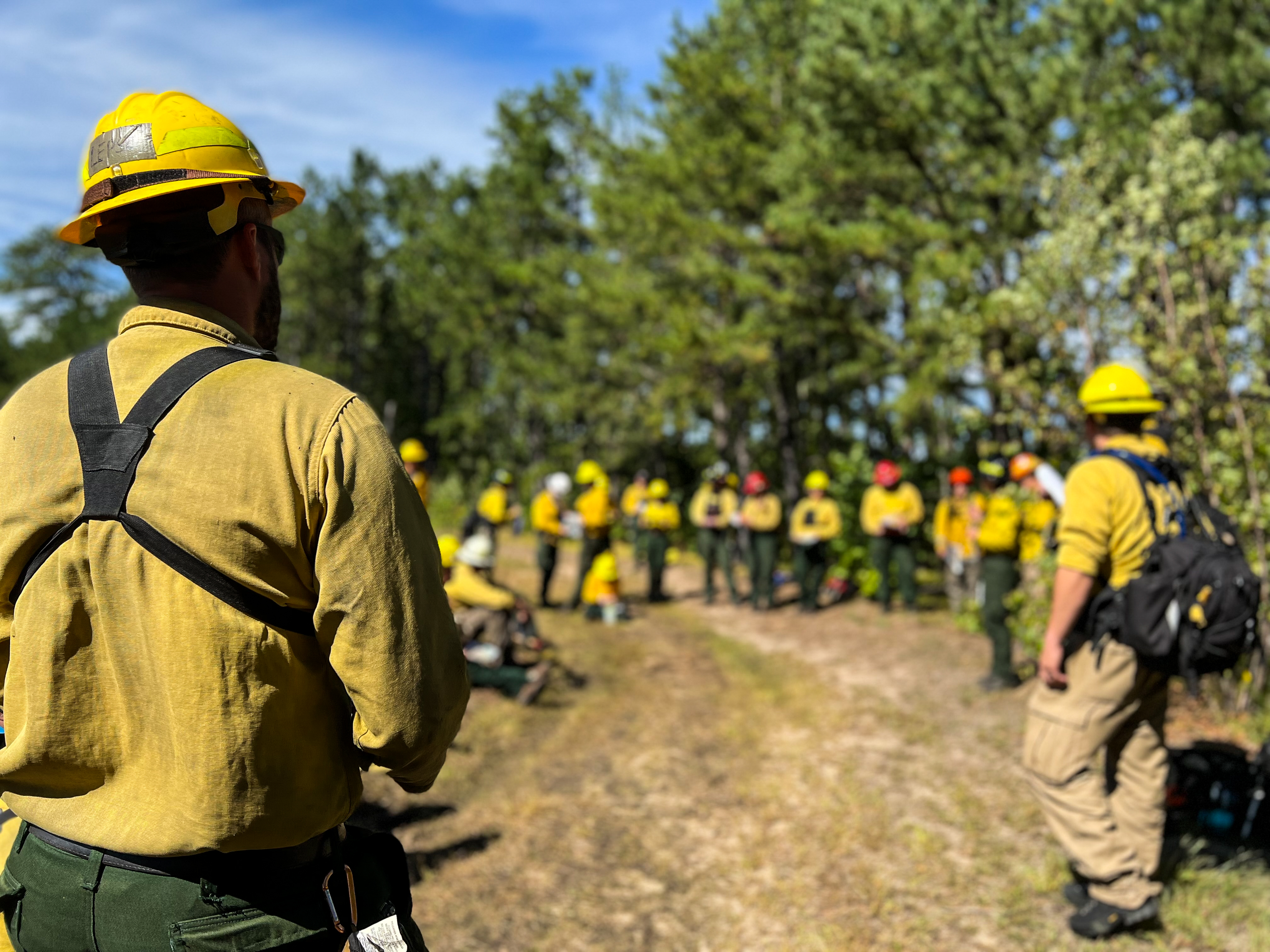fire crew gathered for a pre-burn briefing