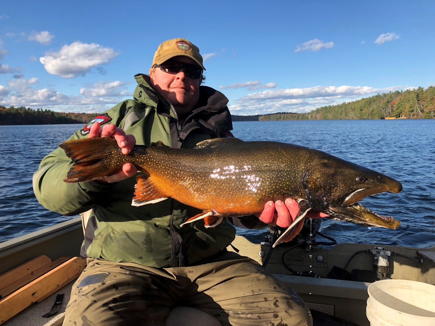 fisheries biologist holding a splake