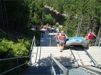 People carrying a raft