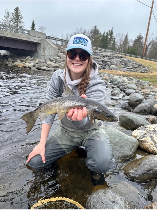 woman catching a salmon