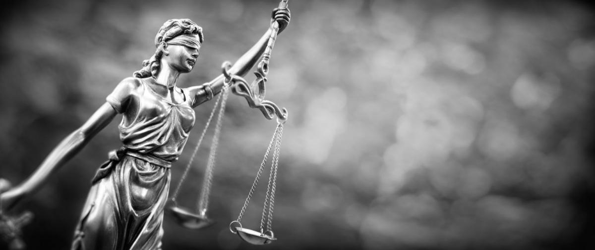 Statute of a blindfolded Lady Justice holding scales