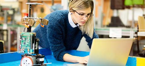 Woman working on robotics