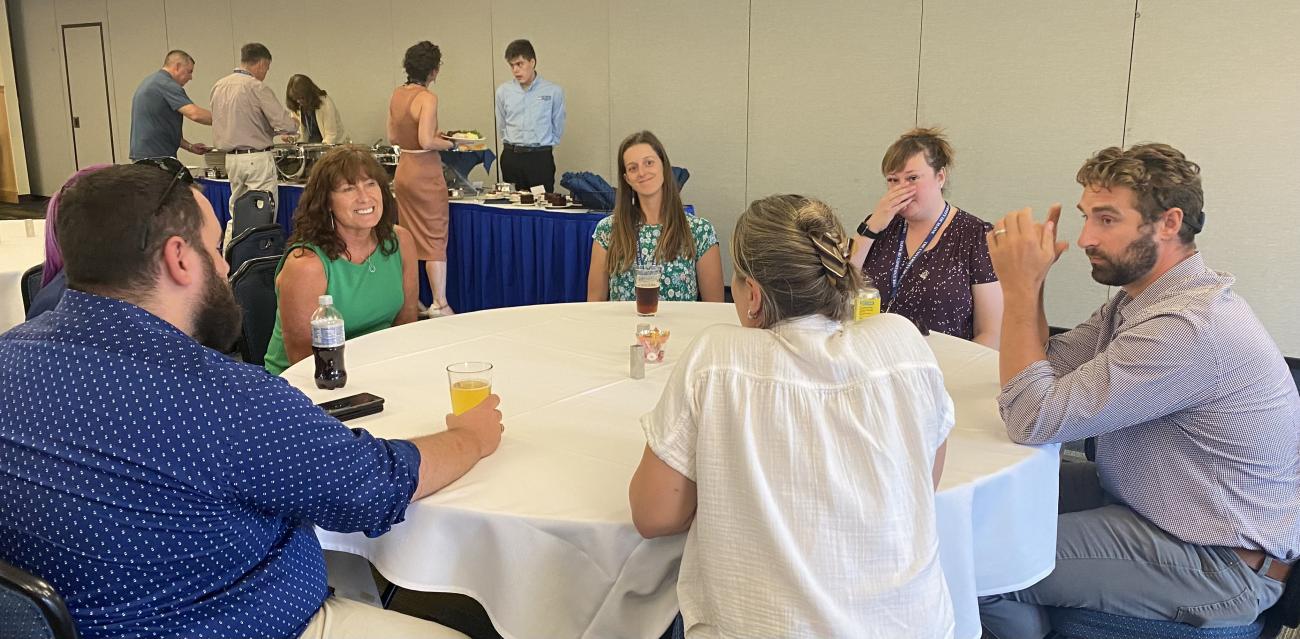 Commissioner Makin talking with ELO Coordinators