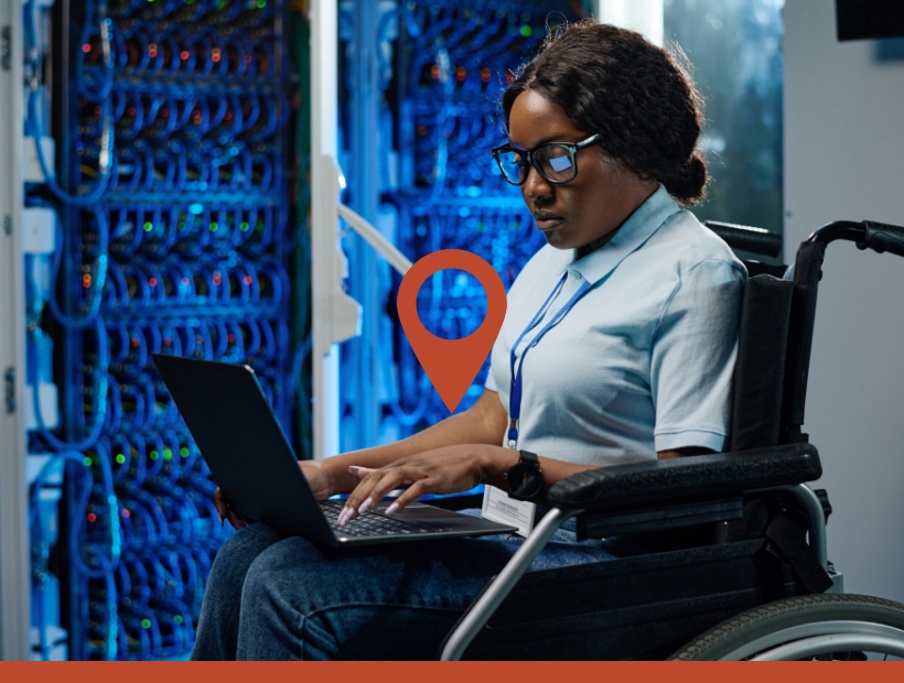 Woman in a wheelchair working on a laptop