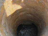 Looking down into an old granite box culvert