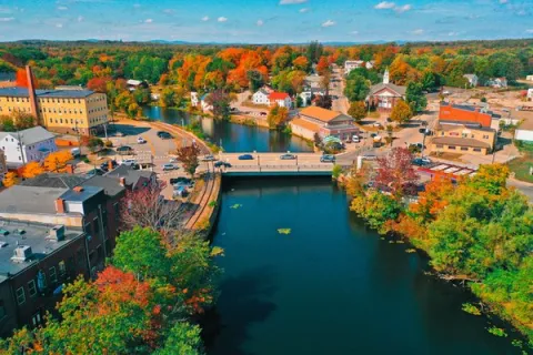 Bridge over a river with autumn colors