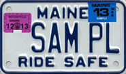 Image of a Maine motorcycle plate with stickers