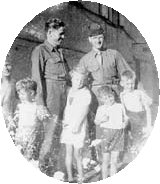 Guy F. Donohue with man and children in England, 1943
