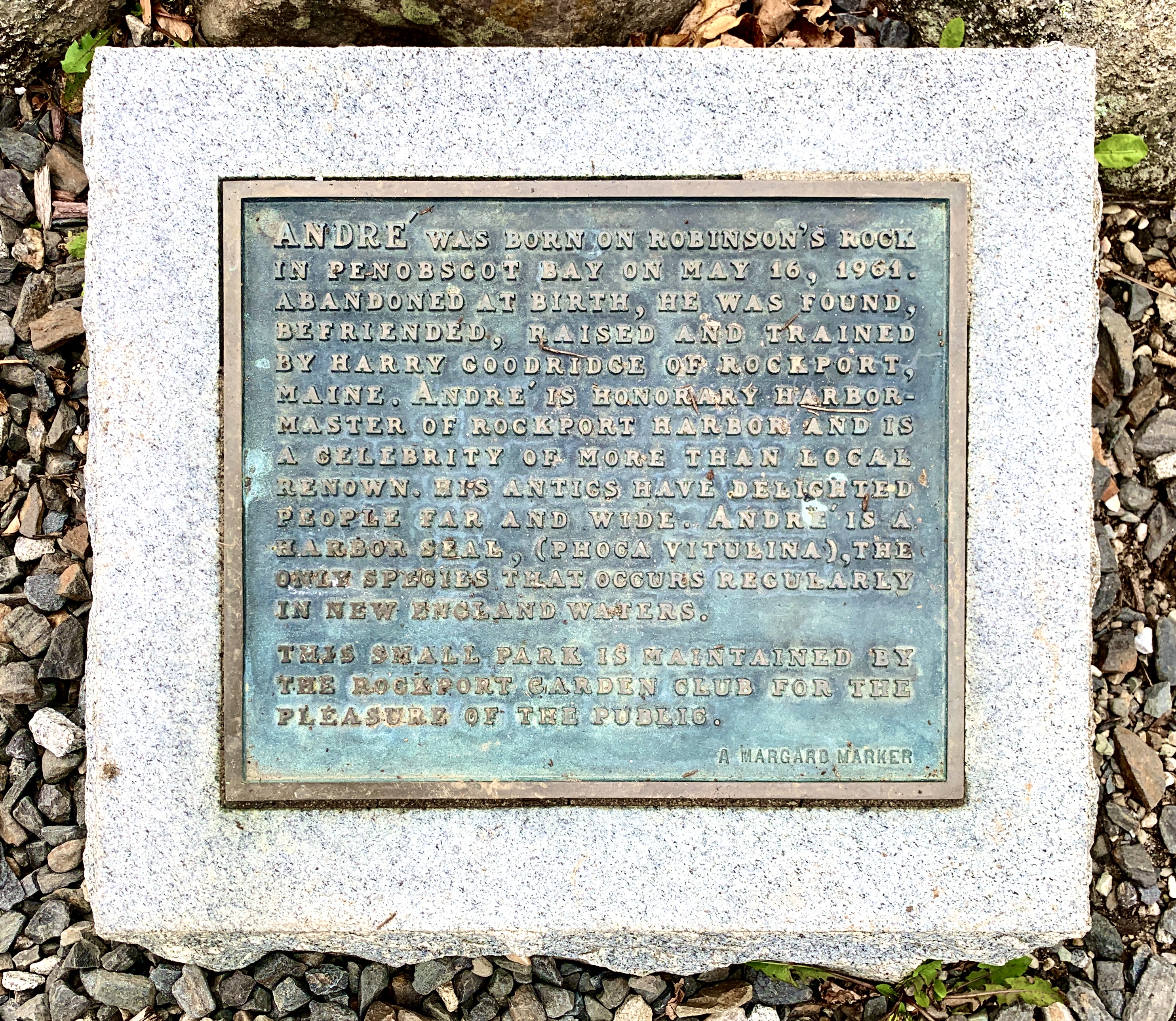 Green plaque with gold text about Andre the Seal