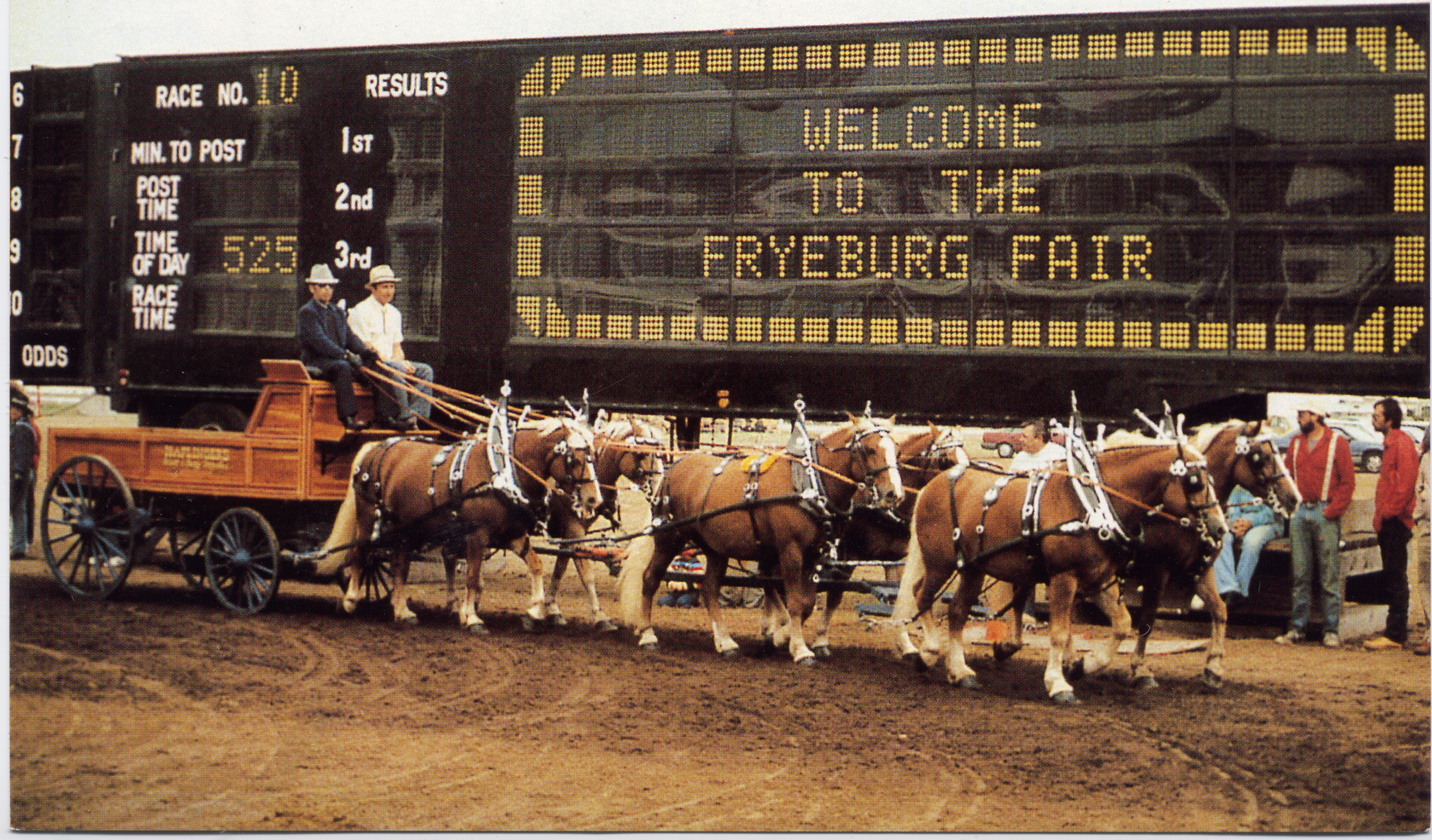 Horses in front of a sign for the Fryeburg Fair