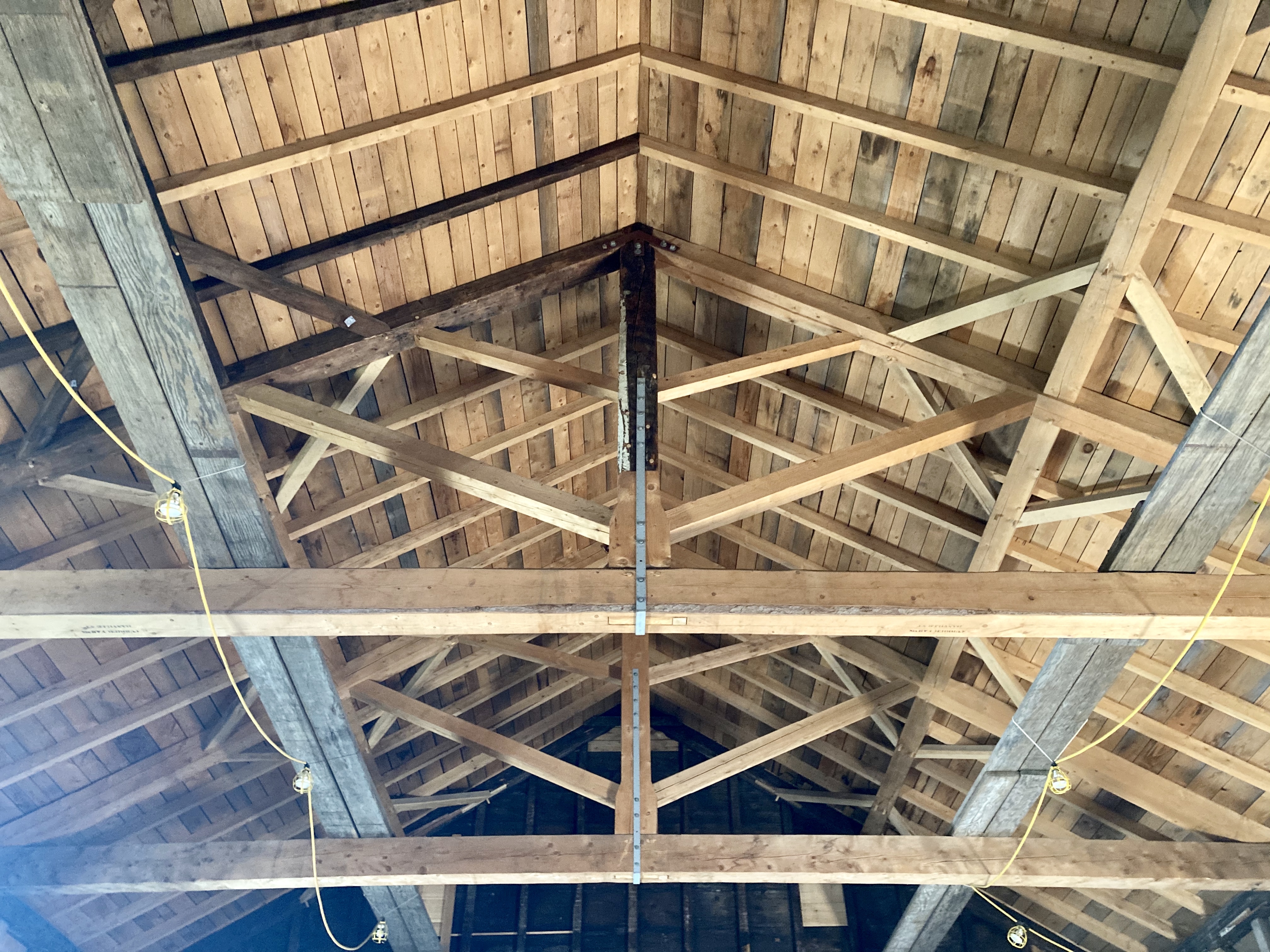 Roof structure of a building showing new and old materials. 