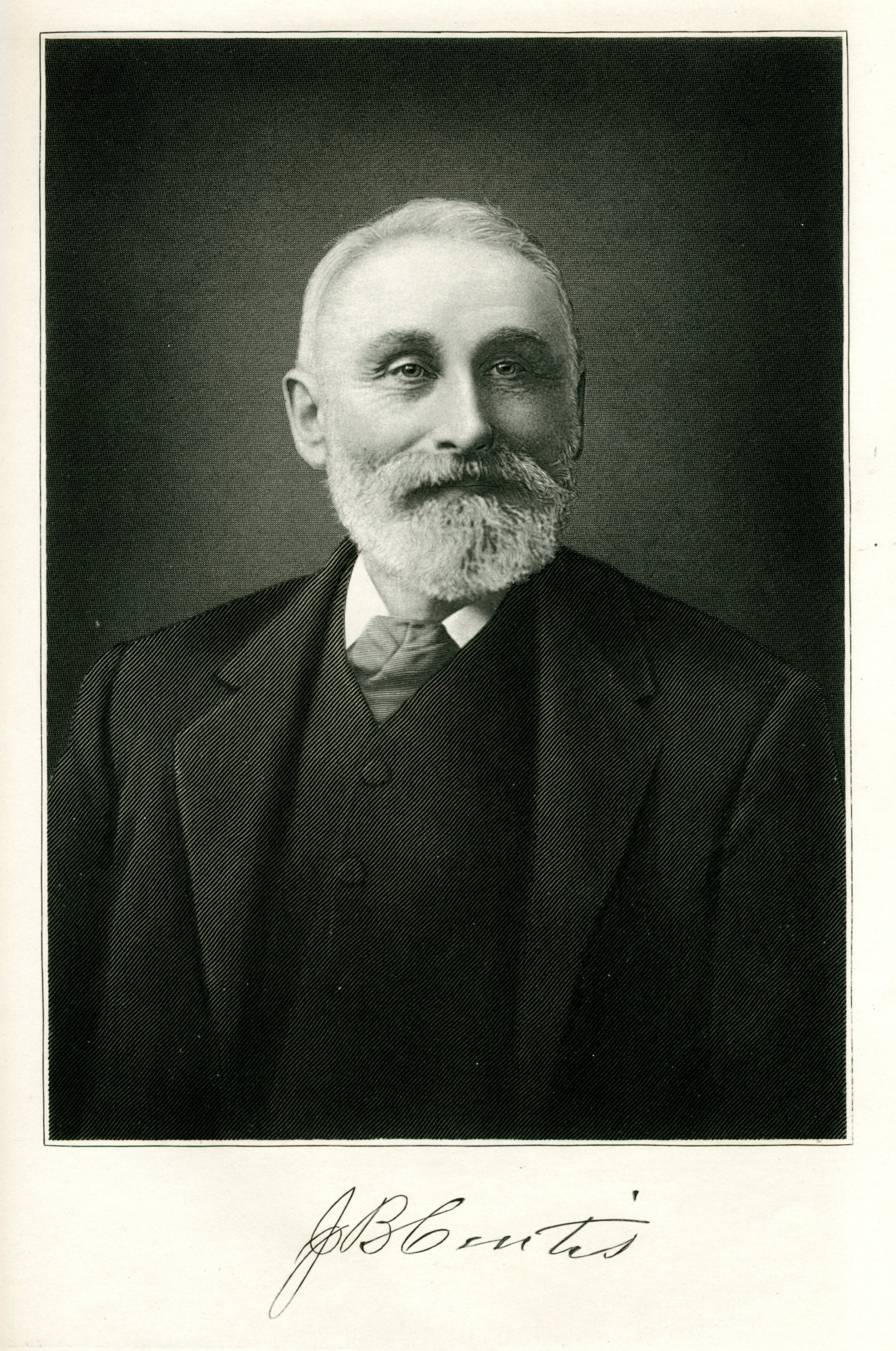 Portrait of older bearded man in black suit